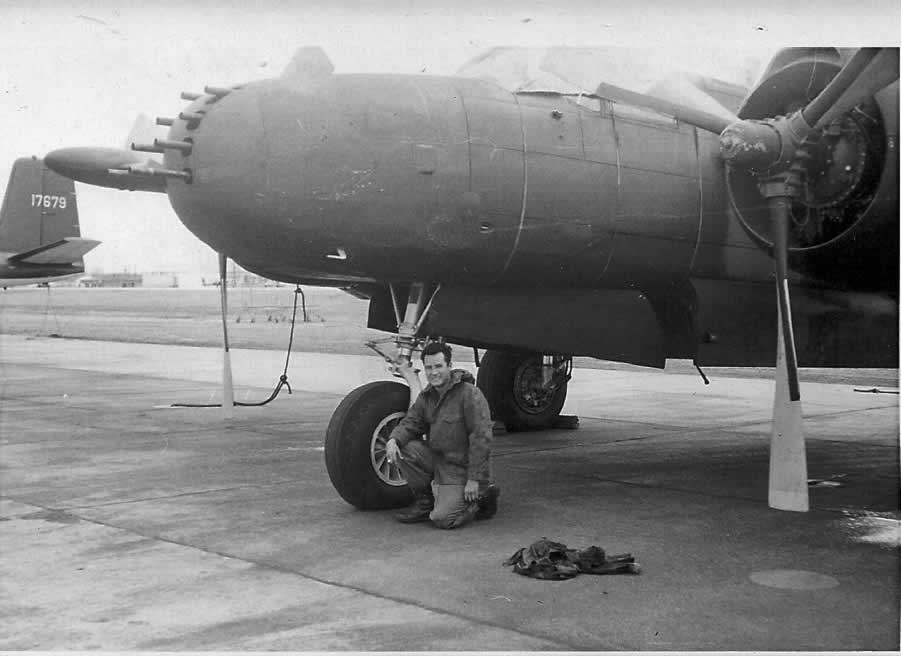 Ed Flores in front of an A-26 aircraft at England Air Force Base, January 11, 1967